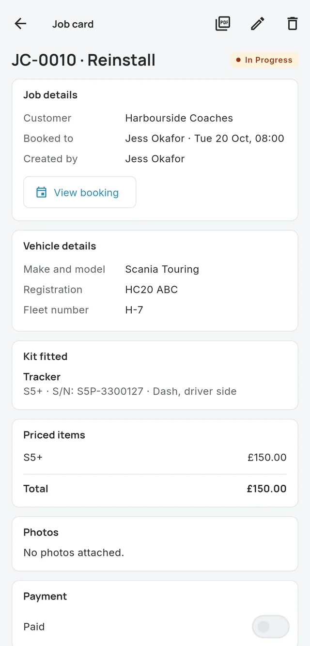 A job card on a phone showing the customer, vehicle, kit fitted and priced items
